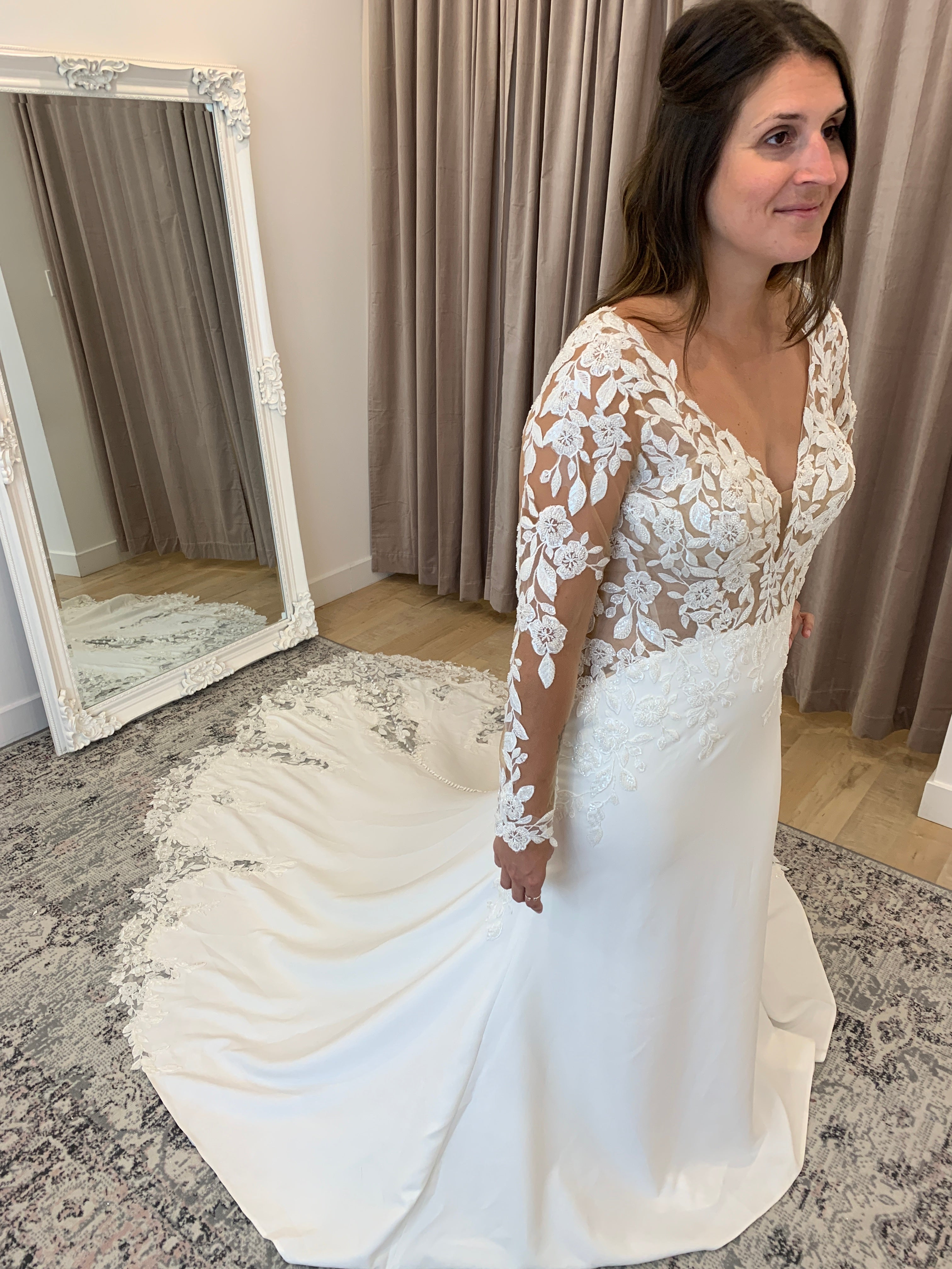 Austina - slim fit wedding dress with long sleeves in embroidered lace with crepe bottom and lace insert in the train Austina - slim fit wedding dress with long sleeves in embroidered lace with crepe bottom and lace insert in the train