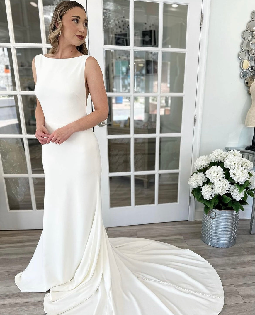 *EXCLUSIVE* Silas - sleek, fitted modern wedding dress with Sabrina neckline and sheer side openings