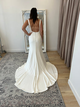 *EXCLUSIVE* Silas - sleek, fitted modern wedding dress with Sabrina neckline and sheer side openings