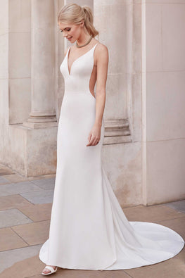 Colonnel - fitted and refined modern wedding dress with thin straps and transparent openings on the sides