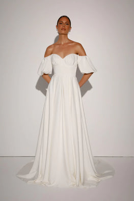 Pebble - modern wedding dress in stretch matte satin, off the shoulder and voluminous skirt