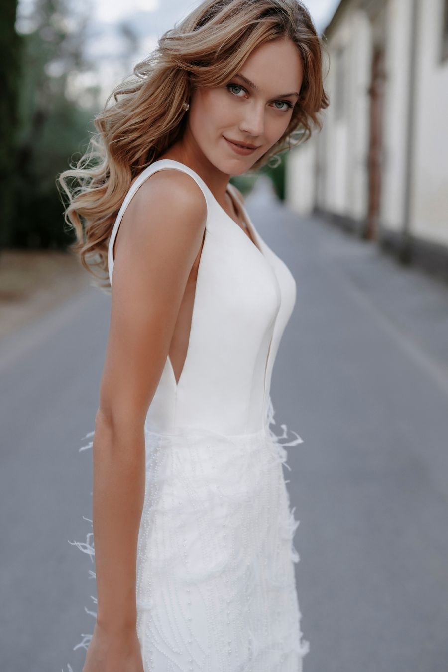 Misty - wedding dress with modern top and fitted skirt with feathers and beads
