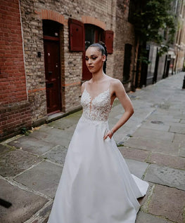 Ranger - classic wedding dress with illusion lace plunging neckline and matte satin skirt with pockets